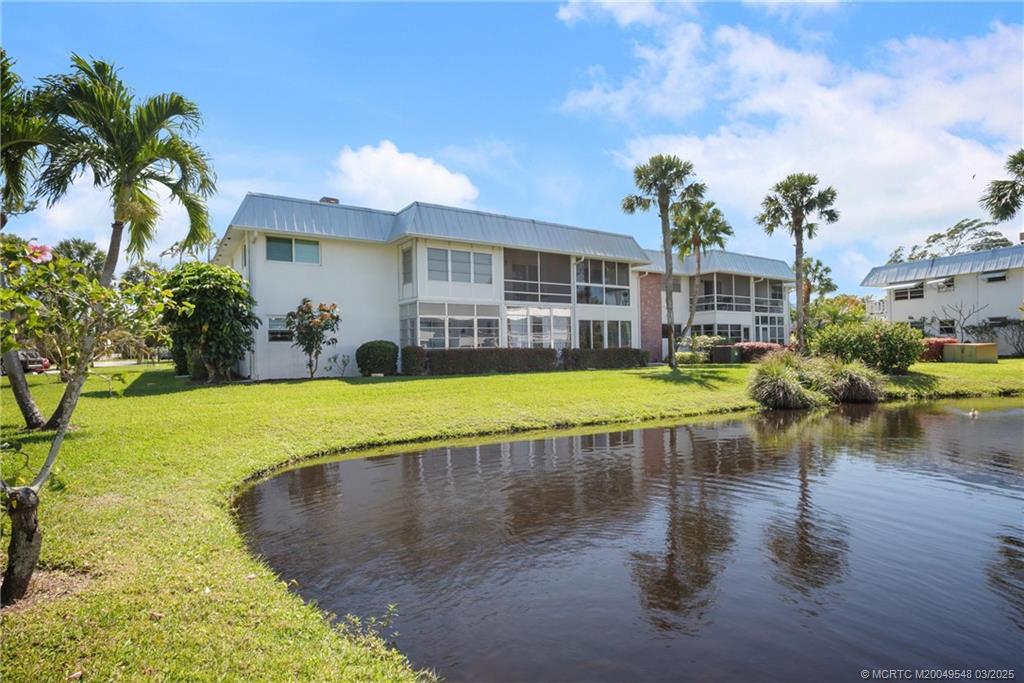 2929 Southeast Ocean Boulevard, Unit K7 Stuart, FL 34996 - Photo 17 of 18 a view of a swimming pool with a patio