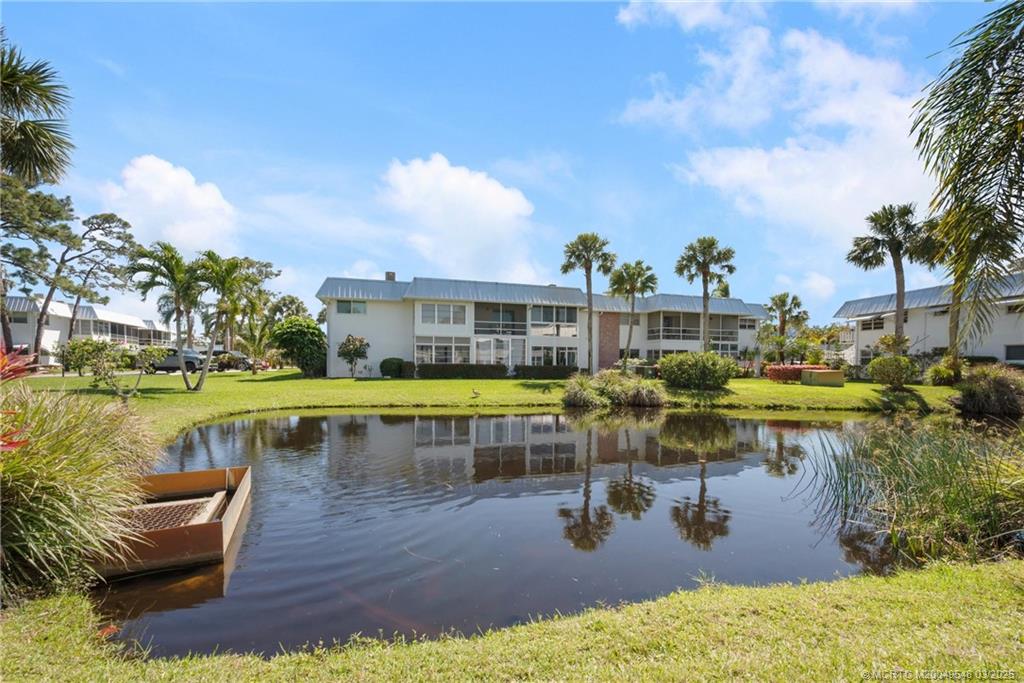 2929 Southeast Ocean Boulevard, Unit K7 Stuart, FL 34996 - Photo 18 of 18 a view of a swimming pool with a patio
