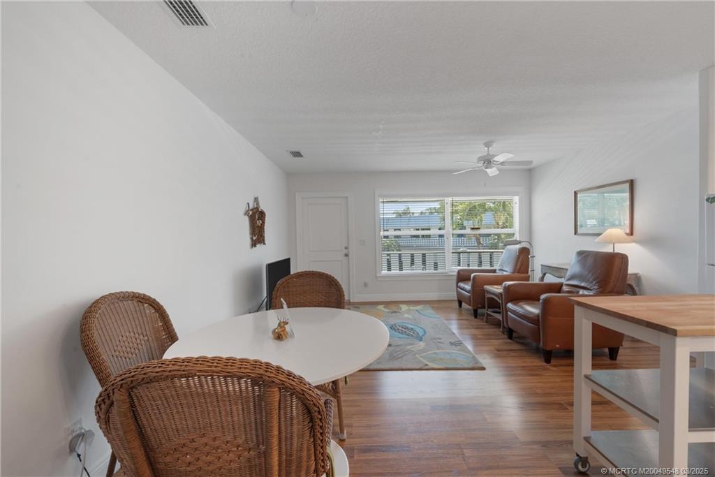 2929 Southeast Ocean Boulevard, Unit K7 Stuart, FL 34996 - Photo 7 of 18 a living room with furniture and a window