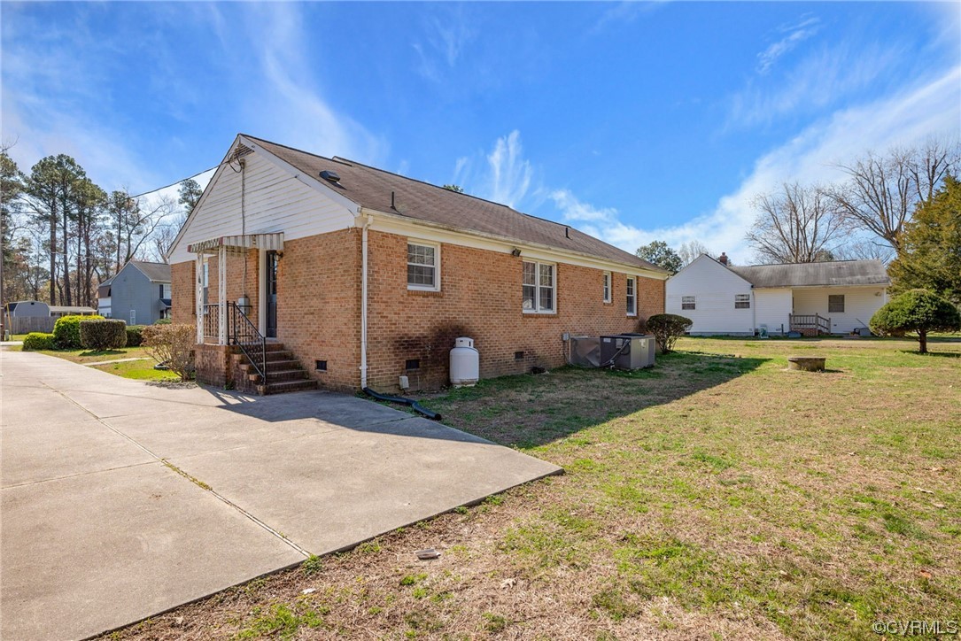 607 Queens Creek Road Williamsburg, VA 23185 - Photo 13 of 13 a view of a house with a yard