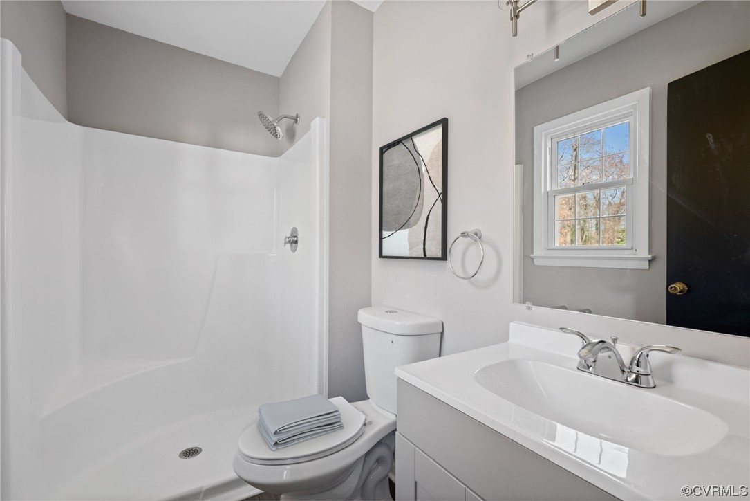 607 Queens Creek Road Williamsburg, VA 23185 - Photo 3 of 13 a bathroom with a sink toilet and shower