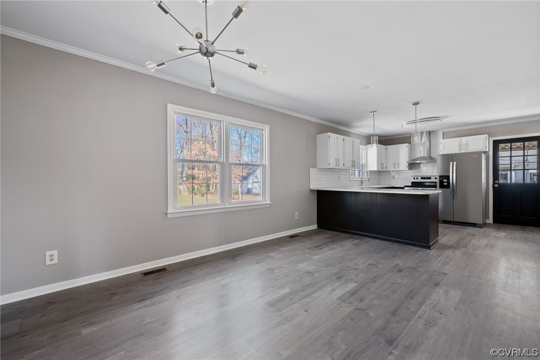 607 Queens Creek Road Williamsburg, VA 23185 - Photo 6 of 13 a view of an empty room with window and wooden floor