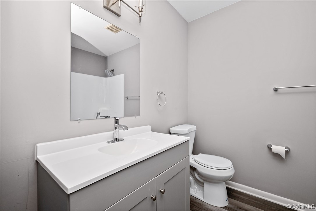 607 Queens Creek Road Williamsburg, VA 23185 - Photo 8 of 13 a bathroom with a sink mirror and toilet