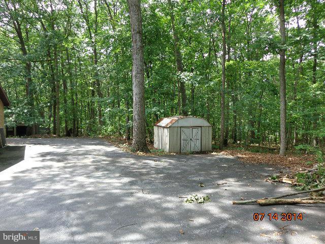 11008 Garrison Hollow Road Clear Spring, MD 21722 - Photo 2 of 30 a view of a backyard with large trees