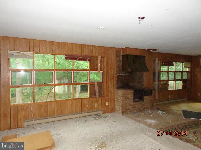 11008 Garrison Hollow Road Clear Spring, MD 21722 - Photo 13 of 30 a view of an empty room with a fireplace
