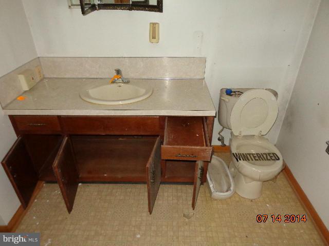 11008 Garrison Hollow Road Clear Spring, MD 21722 - Photo 20 of 30 a bathroom with a sink and a toilet