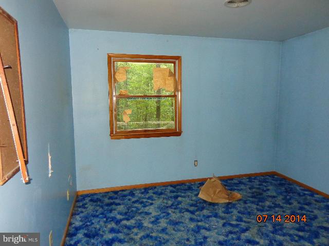 11008 Garrison Hollow Road Clear Spring, MD 21722 - Photo 21 of 30 a room with window and a wooden floor