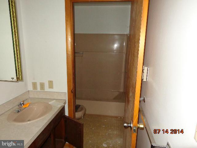 11008 Garrison Hollow Road Clear Spring, MD 21722 - Photo 24 of 30 a bathroom with a tub sink and shower
