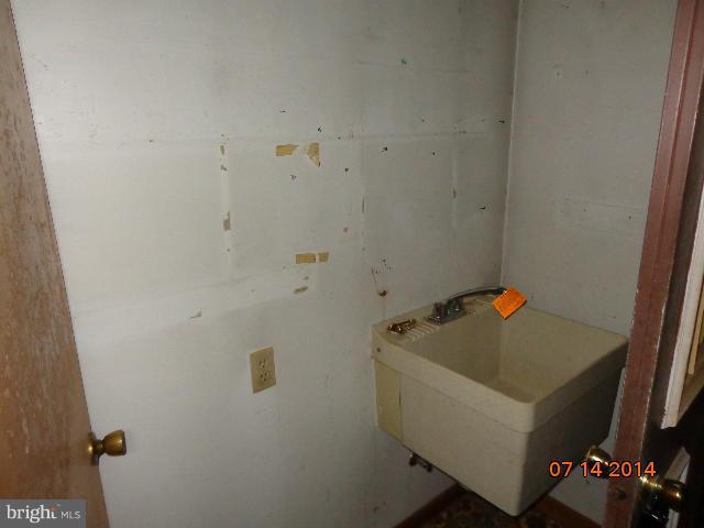 11008 Garrison Hollow Road Clear Spring, MD 21722 - Photo 28 of 30 a bathroom with a tub and sink
