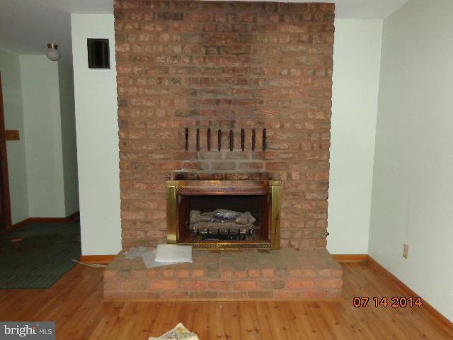 11008 Garrison Hollow Road Clear Spring, MD 21722 - Photo 6 of 30 a living room with a fireplace