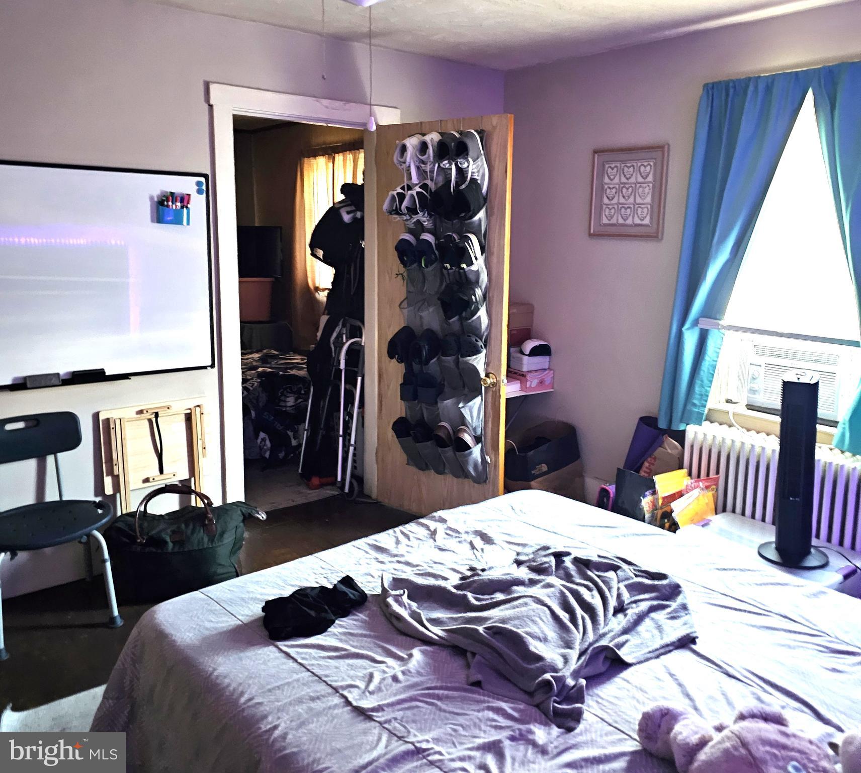 119 Maffitt Street Elkton, MD 21921 - Photo 11 of 14 a bedroom with a bed and a large mirror on the dresser