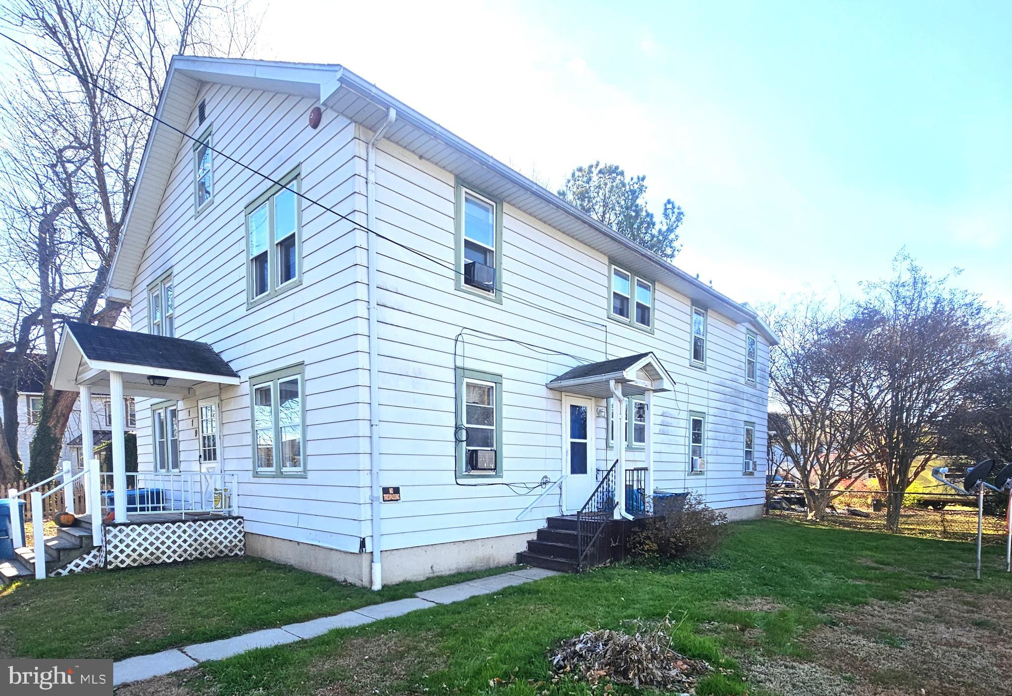 119 Maffitt Street Elkton, MD 21921 - Photo 2 of 14 a front view of a house with a garden