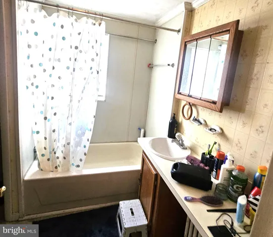 a bathroom with a bathtub sink and toilet