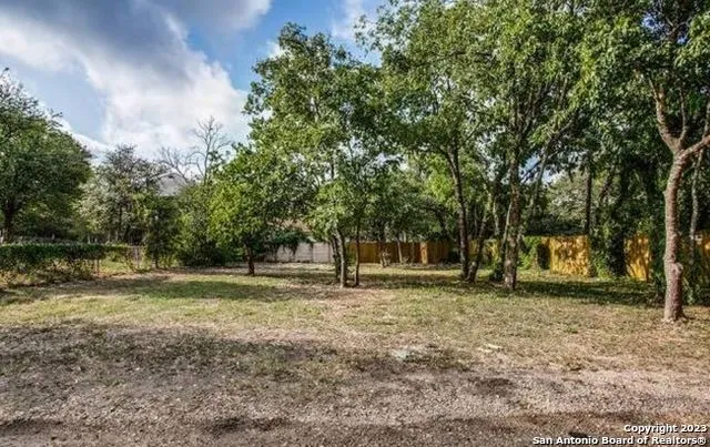 a picture of a bathroom with a street sign and a window