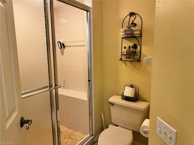 a bathroom with a toilet and a sink
