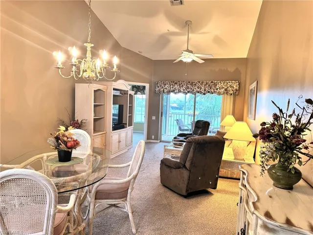 a living room with furniture chandelier and a chandelier