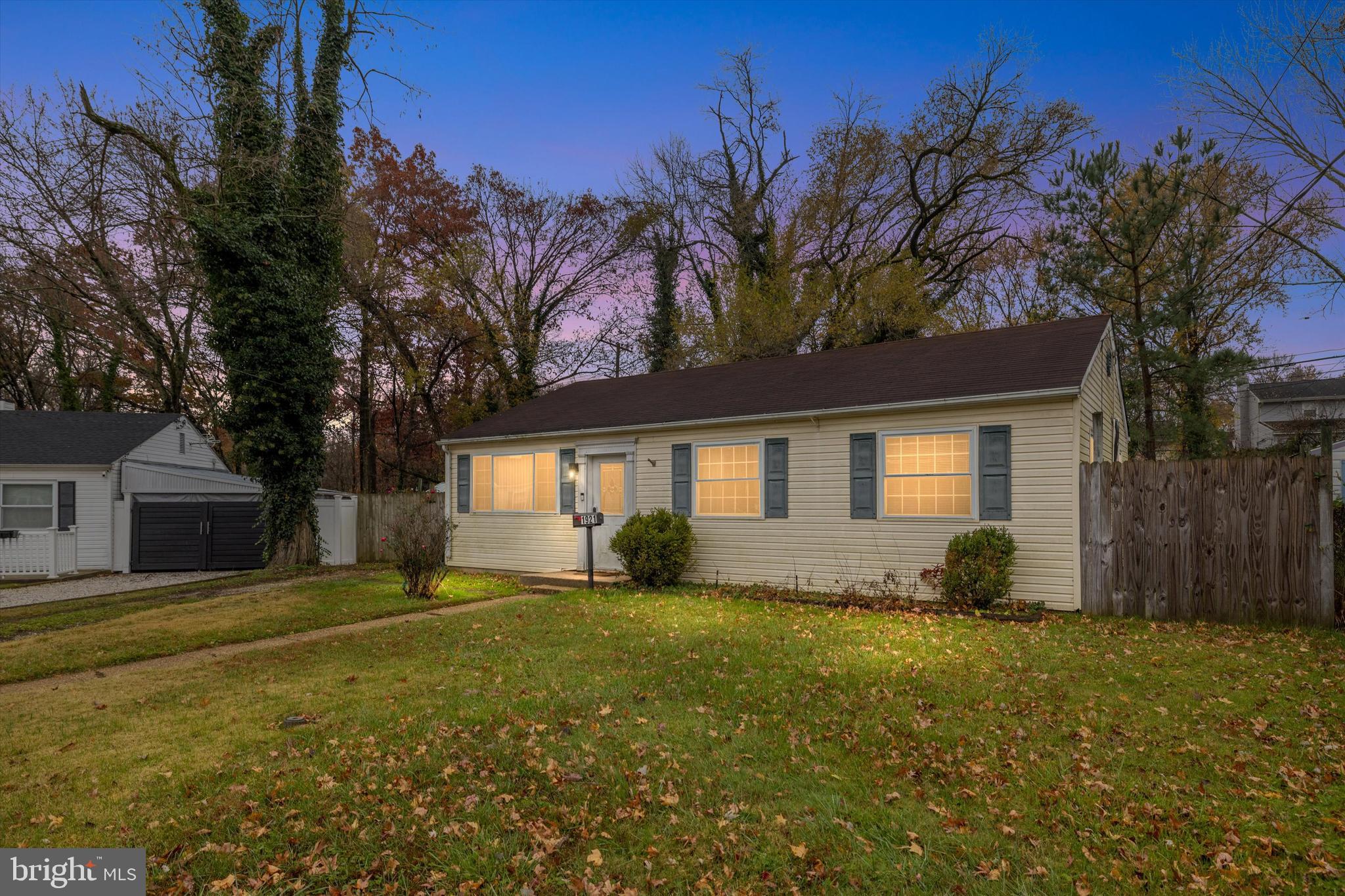 1921 Norwich Road Glen Burnie, MD 21061 - Photo 1 of 37 a front view of house with yard and trees around