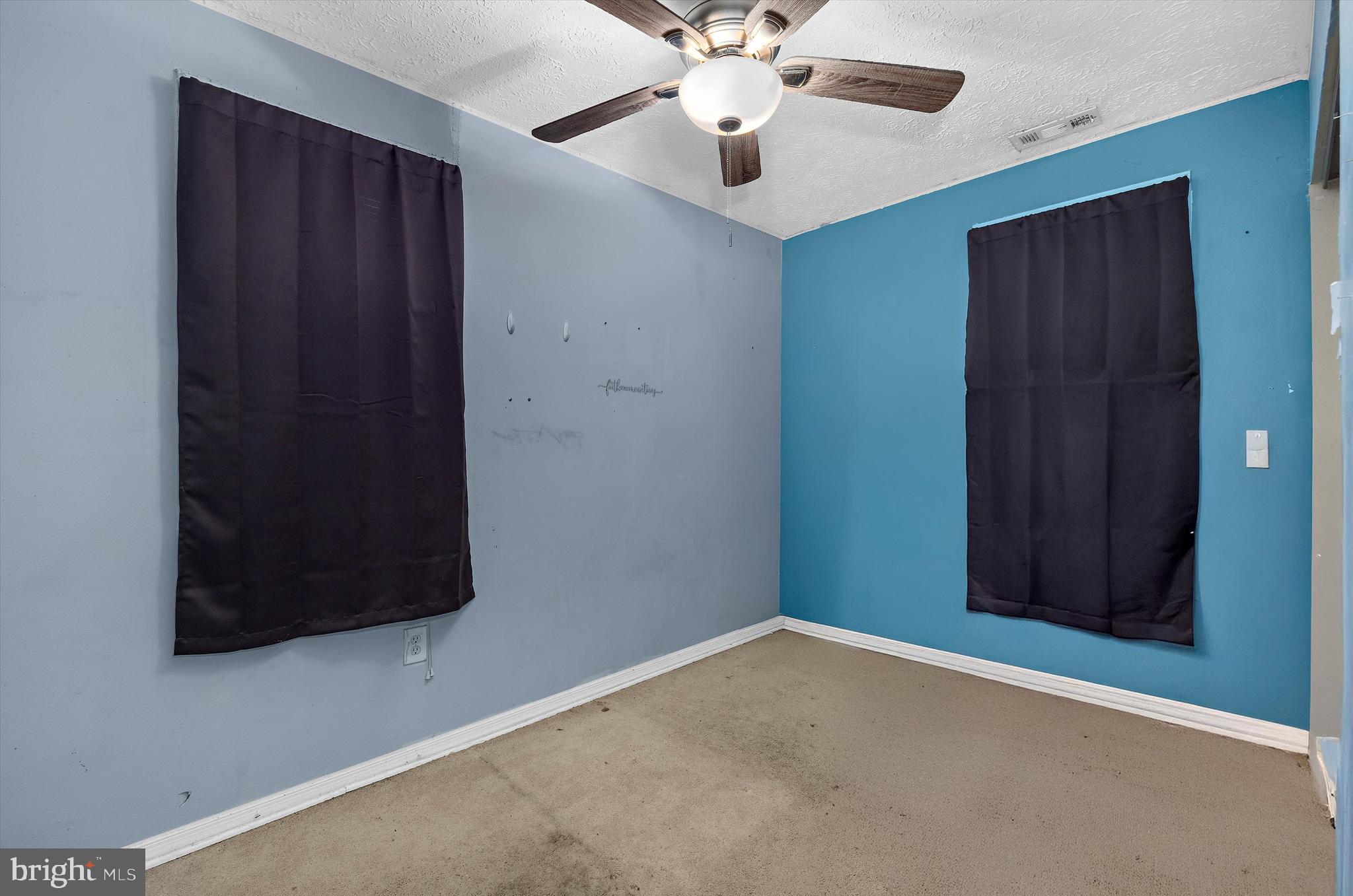 1921 Norwich Road Glen Burnie, MD 21061 - Photo 16 of 37 an empty room with a ceiling fan and a window