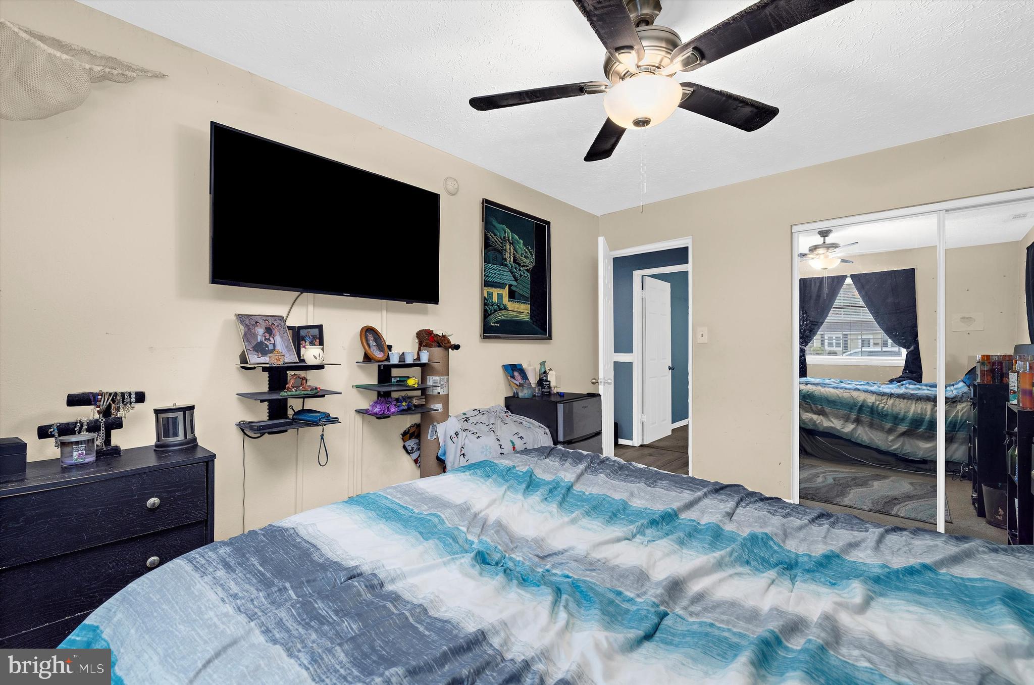 1921 Norwich Road Glen Burnie, MD 21061 - Photo 21 of 37 a bedroom with a bed and a flat screen tv