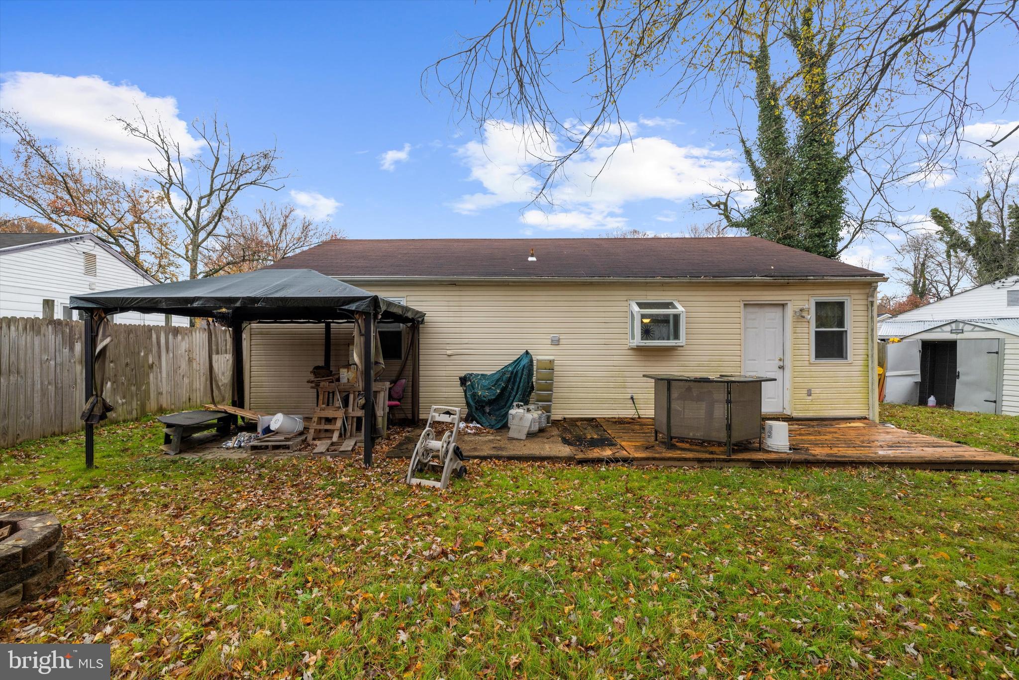 1921 Norwich Road Glen Burnie, MD 21061 - Photo 23 of 37 a backyard of a house with yard table and chairs