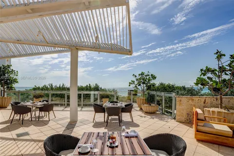 a outdoor living space with furniture and garden view