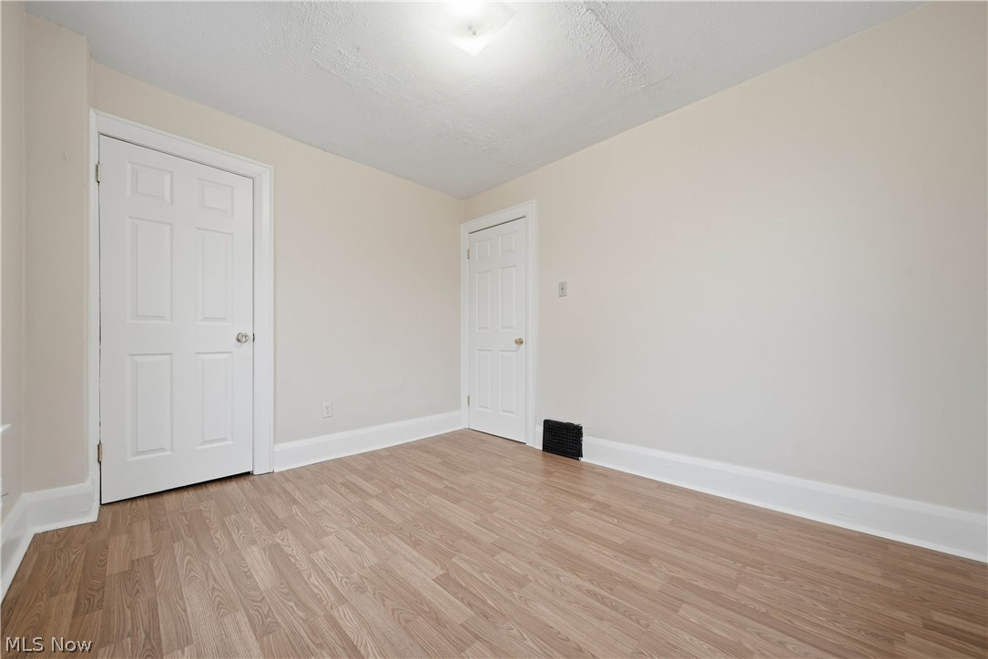 225 Cranz Place Akron, OH 44310 - Photo 22 of 34 Unfurnished room with light wood-style floors and baseboards