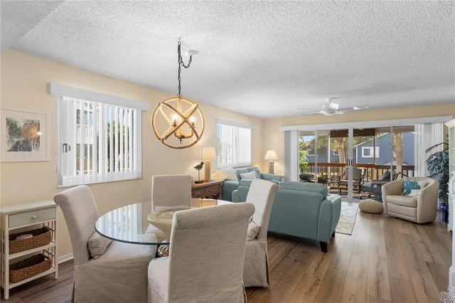 a living room with furniture a couch and a window