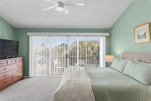 a bed room with a bed and a television