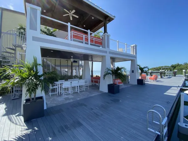 a view of a chairs and table in the patio and a fountain in the patio