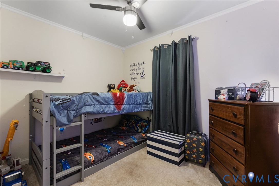 15601 Roland View Drive Chester, VA 23831 - Photo 11 of 18 a bed room with a bed and a television