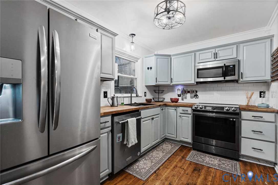 15601 Roland View Drive Chester, VA 23831 - Photo 7 of 18 a kitchen with stainless steel appliances granite countertop a refrigerator a stove top oven a sink and dishwasher