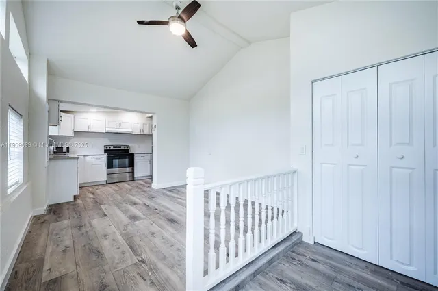 a view of kitchen with sink microwave and stove