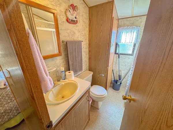a bathroom with a sink toilet and tub