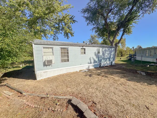 a view of a backyard of the house