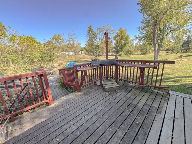a view of deck with wooden floor and fence