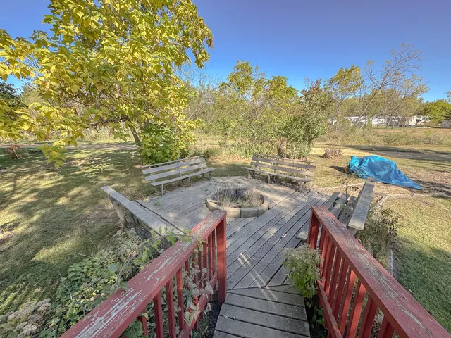 a view of a balcony and trees