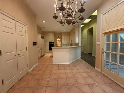a view of a kitchen with a sink and cabinets