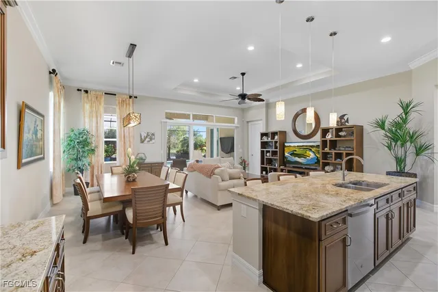 a kitchen with a table chairs stove and refrigerator