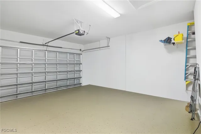 a dining room with furniture a chandelier and wooden floor