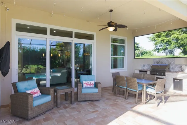 a view of a patio with a dining table and chairs