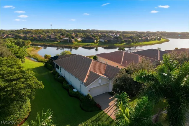 an aerial view of house with yard swimming pool and outdoor seating