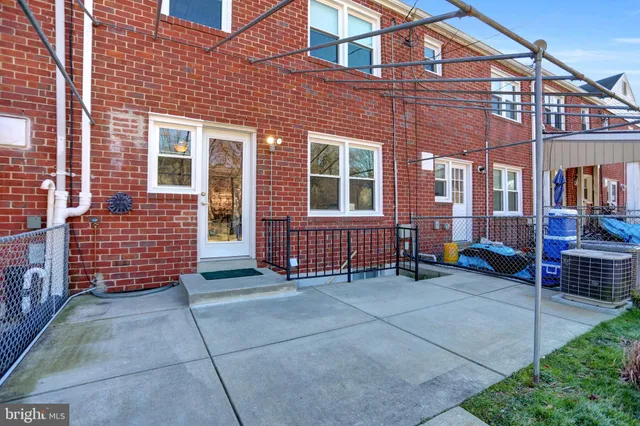 a view of a brick building with many windows
