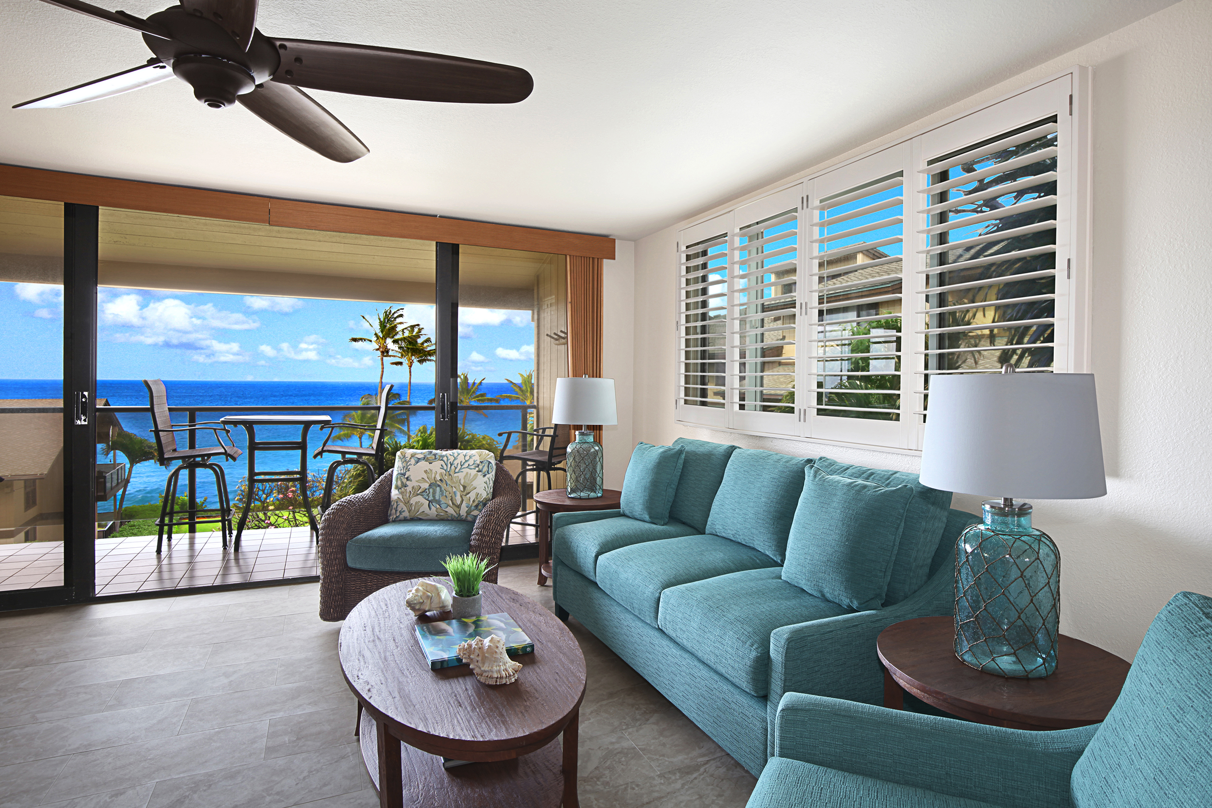 1661 Pee Road, Unit IIA312 Koloa, HI 96756 - Photo 6 of 30 a living room with furniture and a large window