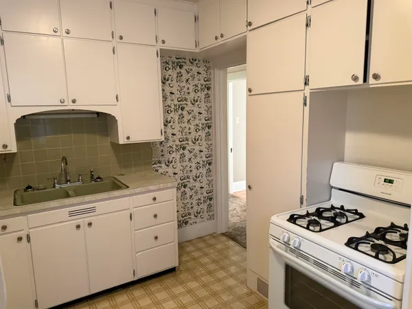 a kitchen with stainless steel appliances a stove and a refrigerator