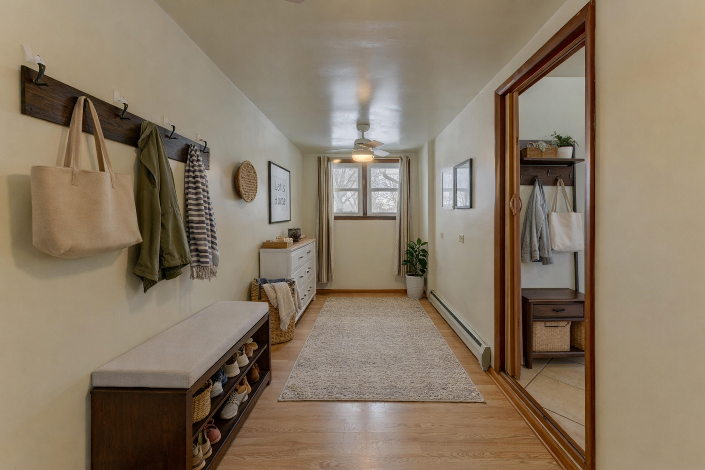 9046 Kleinman Road Highland, IN 46322 - Photo 9 of 20 a hallway with white cabinets and window