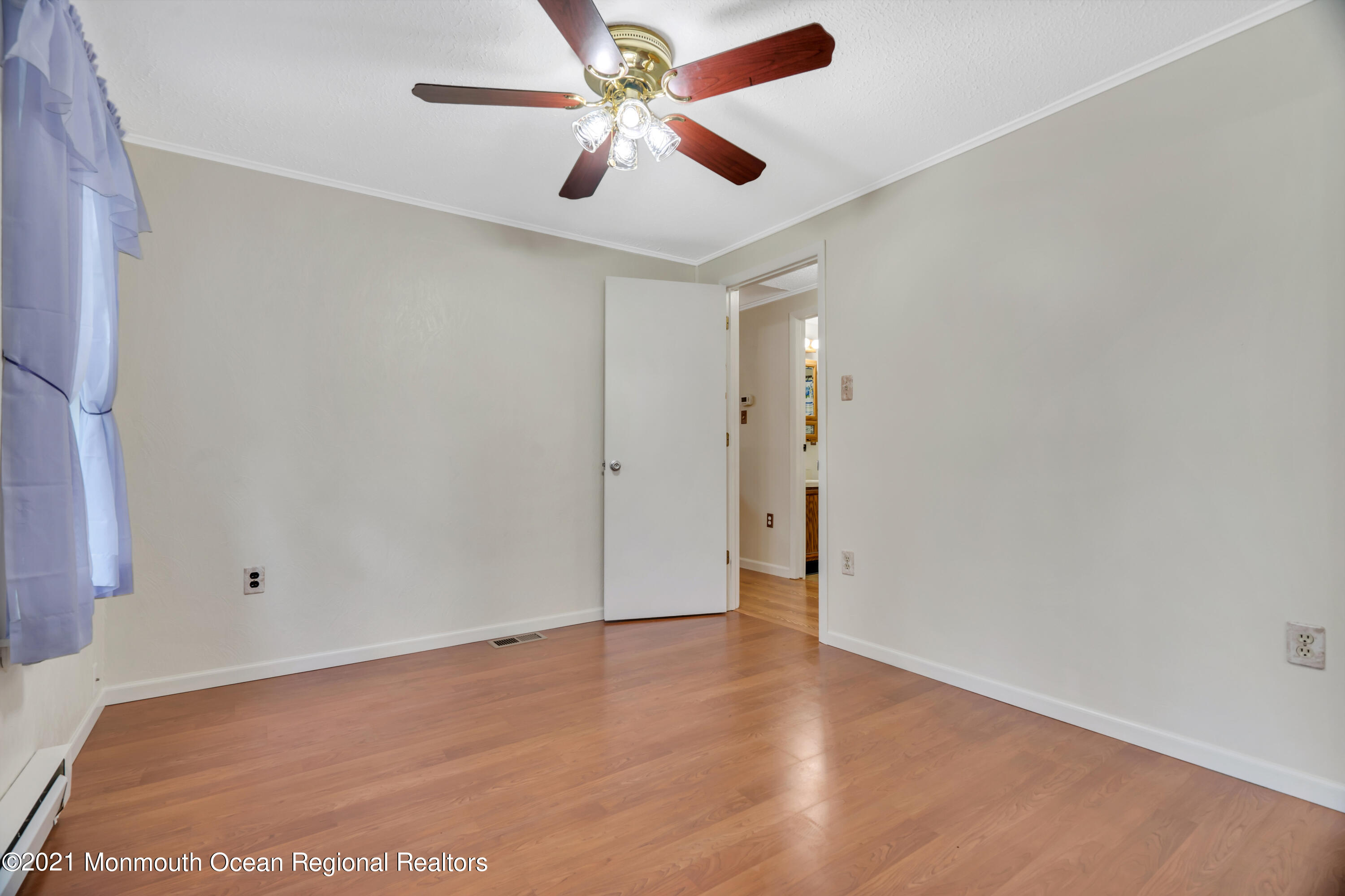 447 Leming Road Jackson, NJ 08527 - Photo 23 of 71 an empty room with closet and a ceiling fan