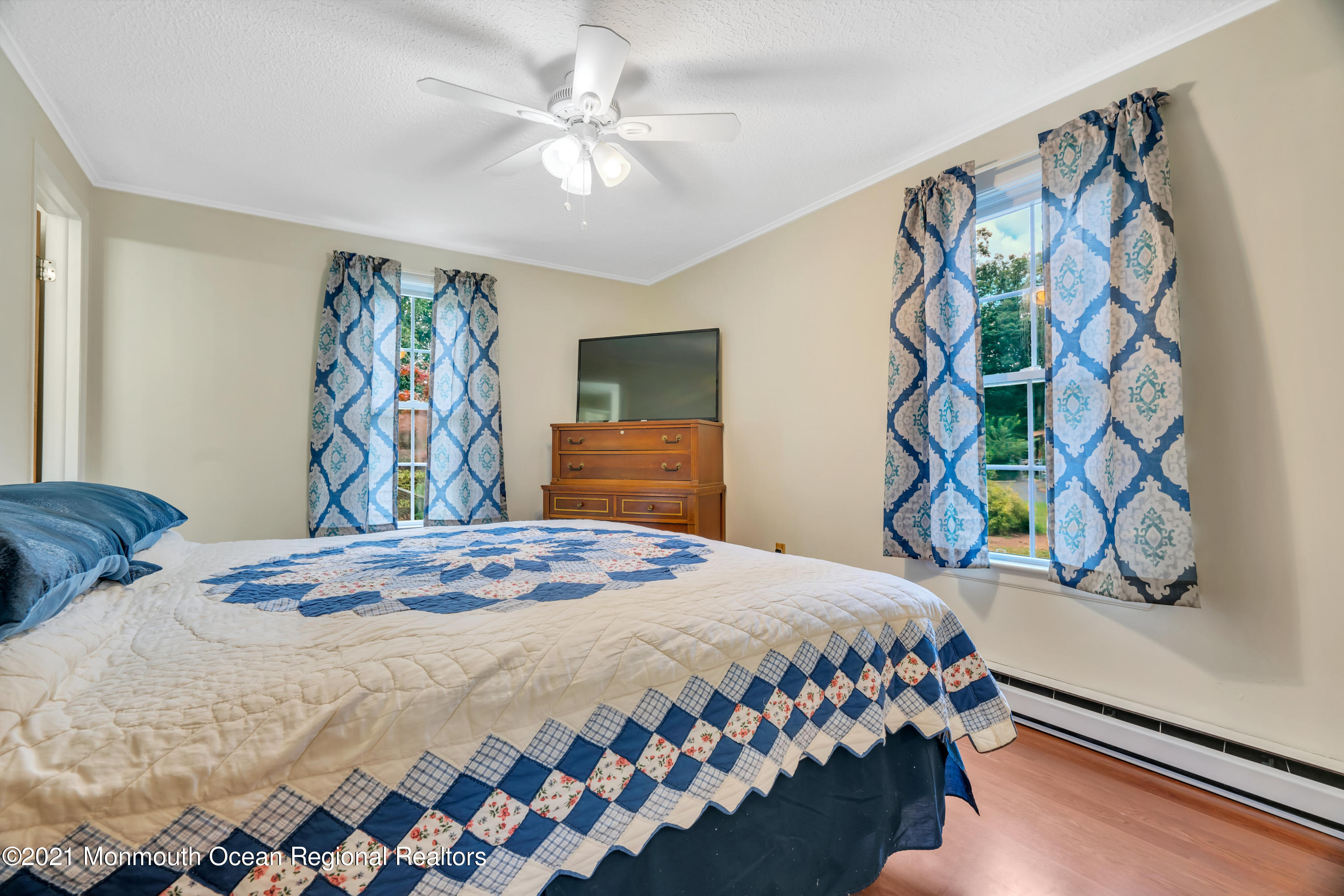 447 Leming Road Jackson, NJ 08527 - Photo 24 of 71 a bedroom with a bed and a window