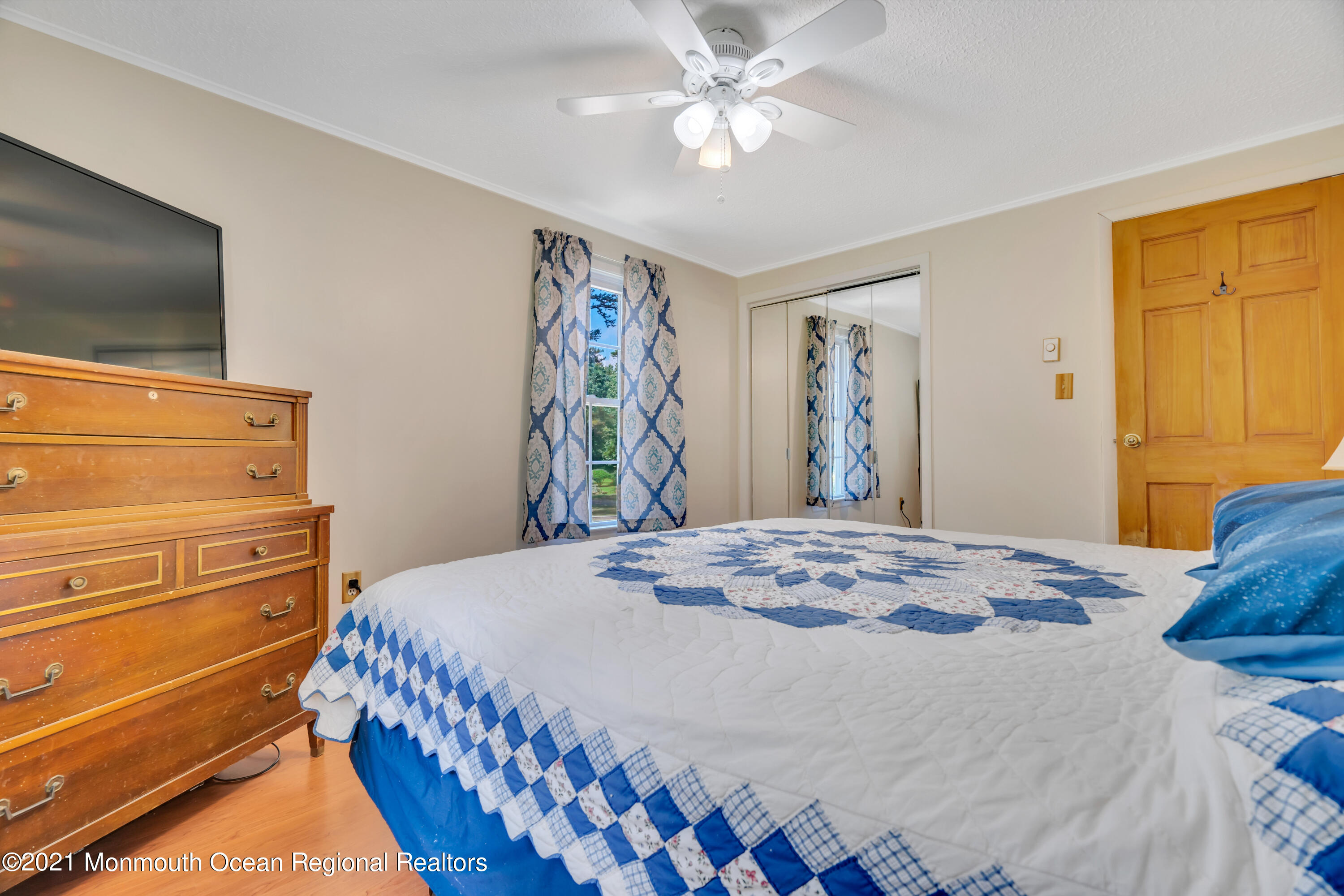 447 Leming Road Jackson, NJ 08527 - Photo 26 of 71 a bedroom with a bed and a flat screen tv