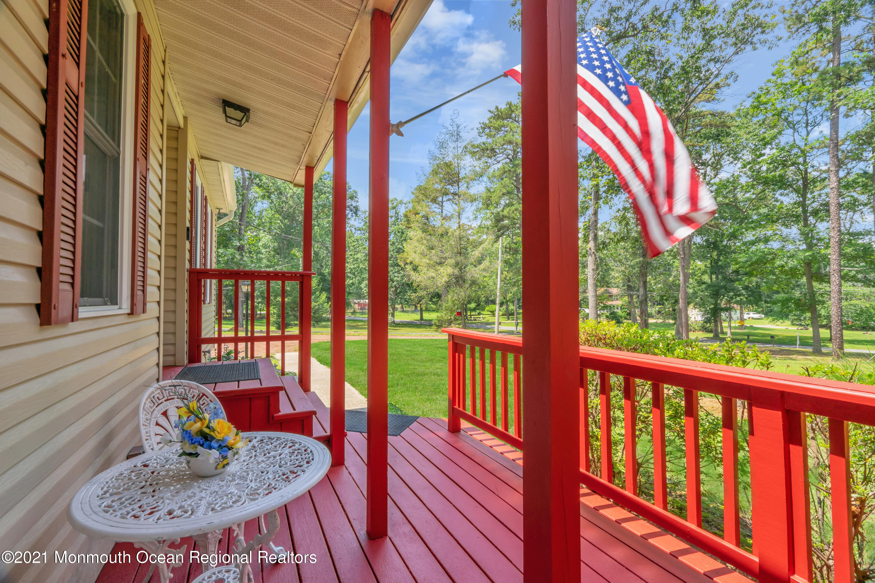 447 Leming Road Jackson, NJ 08527 - Photo 5 of 71 a view of a balcony with furniture and wooden floor