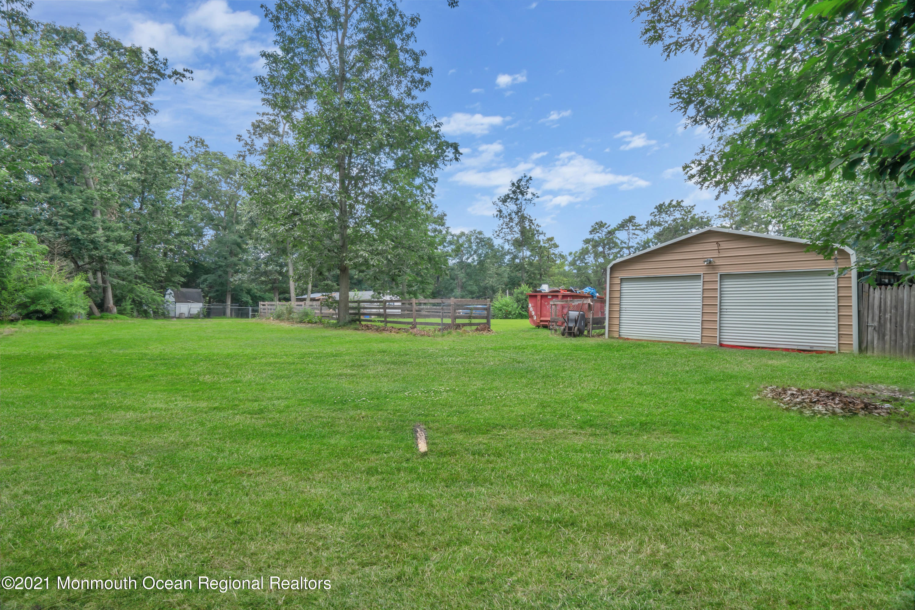 447 Leming Road Jackson, NJ 08527 - Photo 50 of 71 a view of green field with house in the background